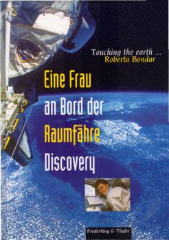 Eine Frau an Bord der Raumfähre Discovery = Touching the earth.