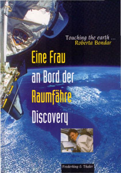 Eine Frau an Bord der Raumfähre Discovery = Touching the earth.
